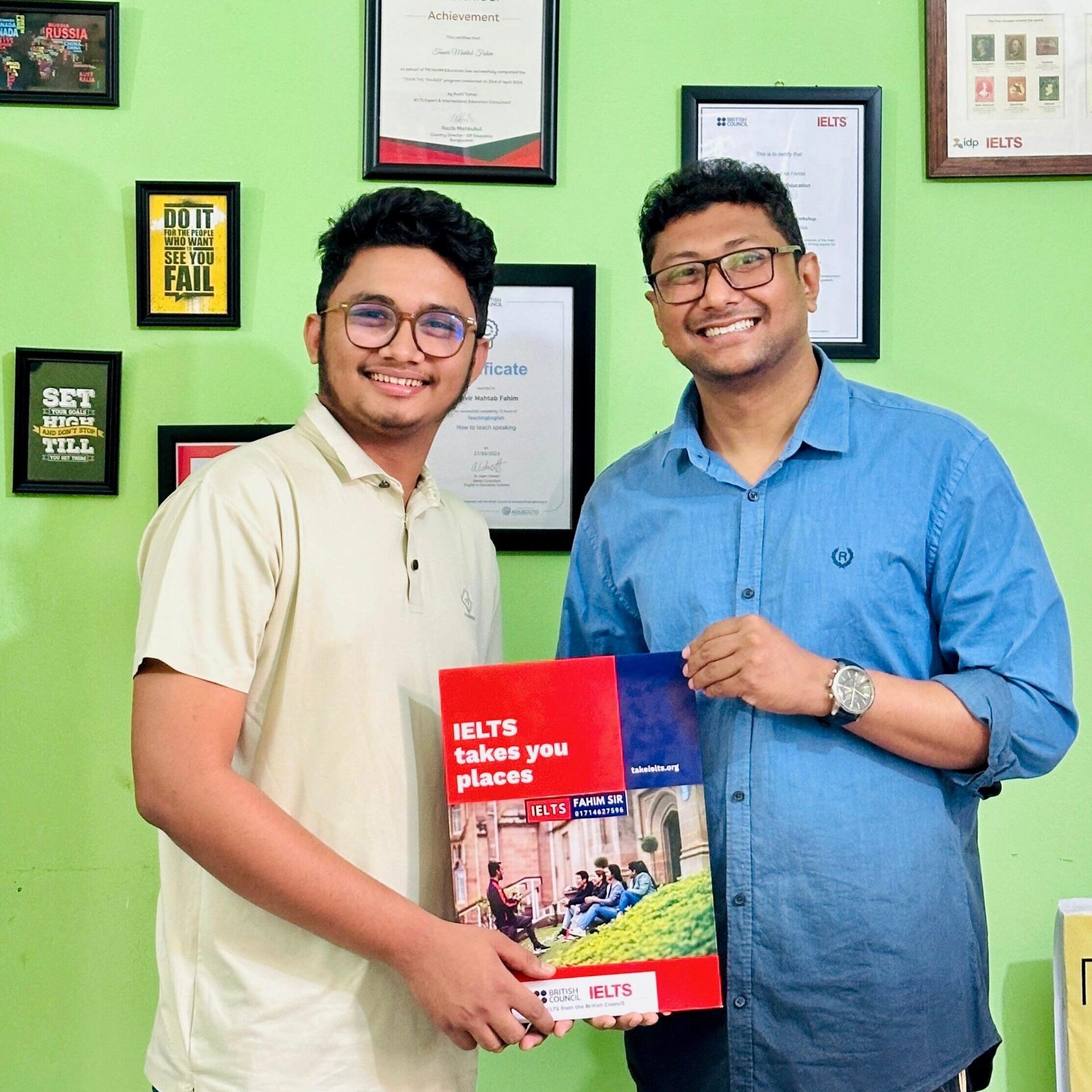 Nazmul Islam Fahad standing with Fahim Sir, holding his IELTS TRF as a symbol of exam success and academic achievement.