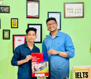 A proud moment for Fuyad Hasan, celebrating his hard-earned IELTS success with a genuine smile.