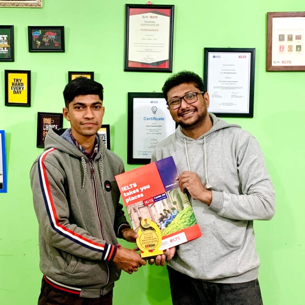 Biprojit Dey celebrating his IELTS success, with a happy expression and holding his official test result.