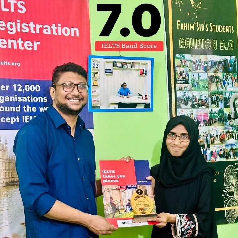 A proud IELTS student, Fahima Sultana Koly, smiling while holding her official IELTS Test Report Form showing a Band 7.0 score.